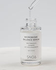 SNOA Microbiome Balance Serum with dropper on a white background