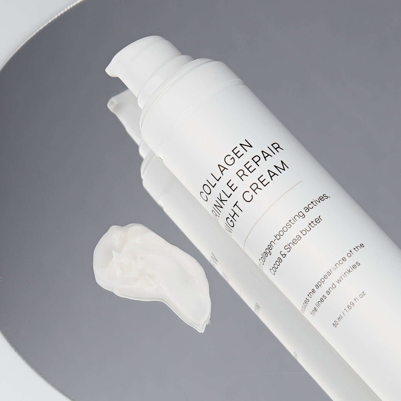 Collage Wrinkle Repair Day Cream bottle with a sample on a gray background