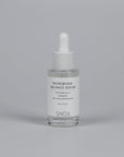 SNOA Microbiome Balance Serum bottle on a gray background