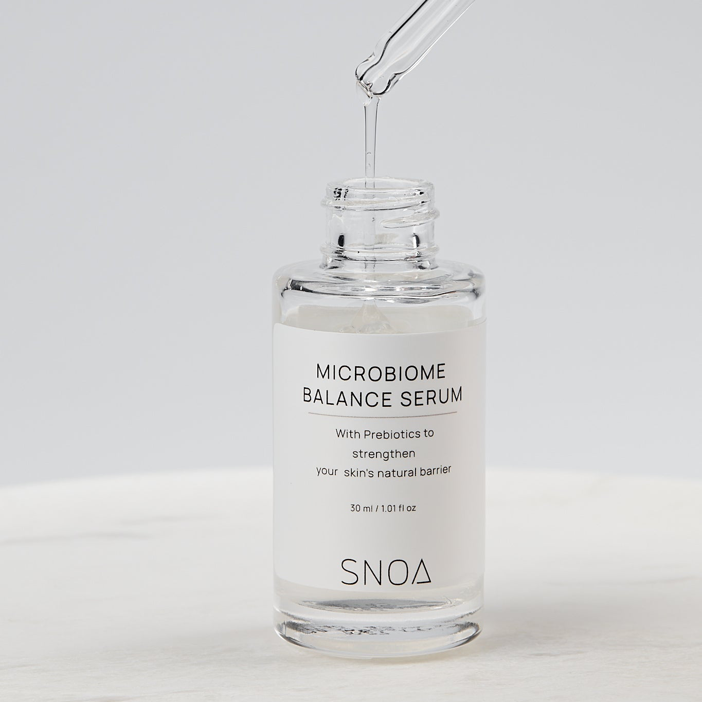 SNOA Microbiome Balance Serum with dropper on a white background