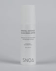 SNOA Mineral Defence Sunscreen bottle on a gray background