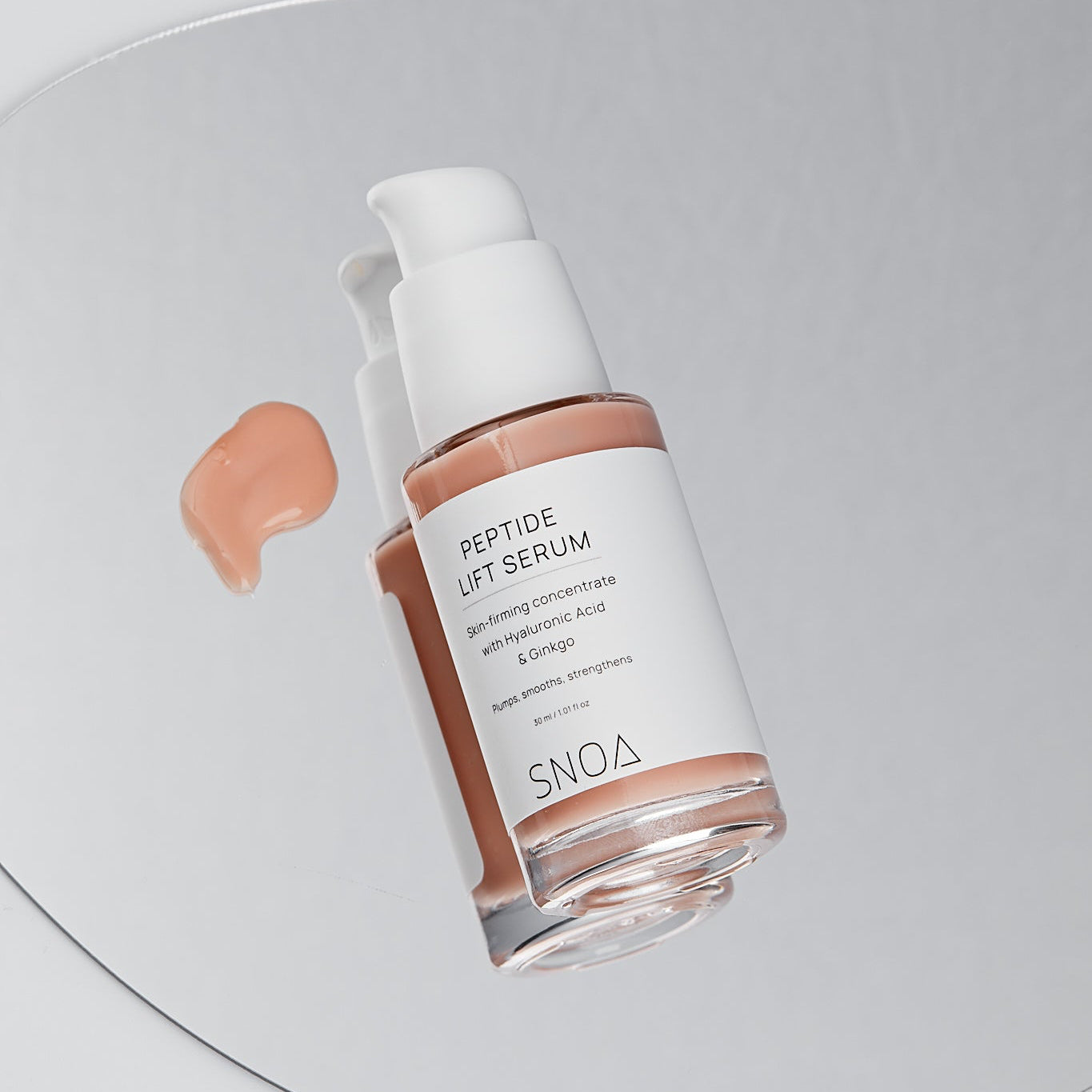 SNOA Peptide Lift Serum bottle on a gray background