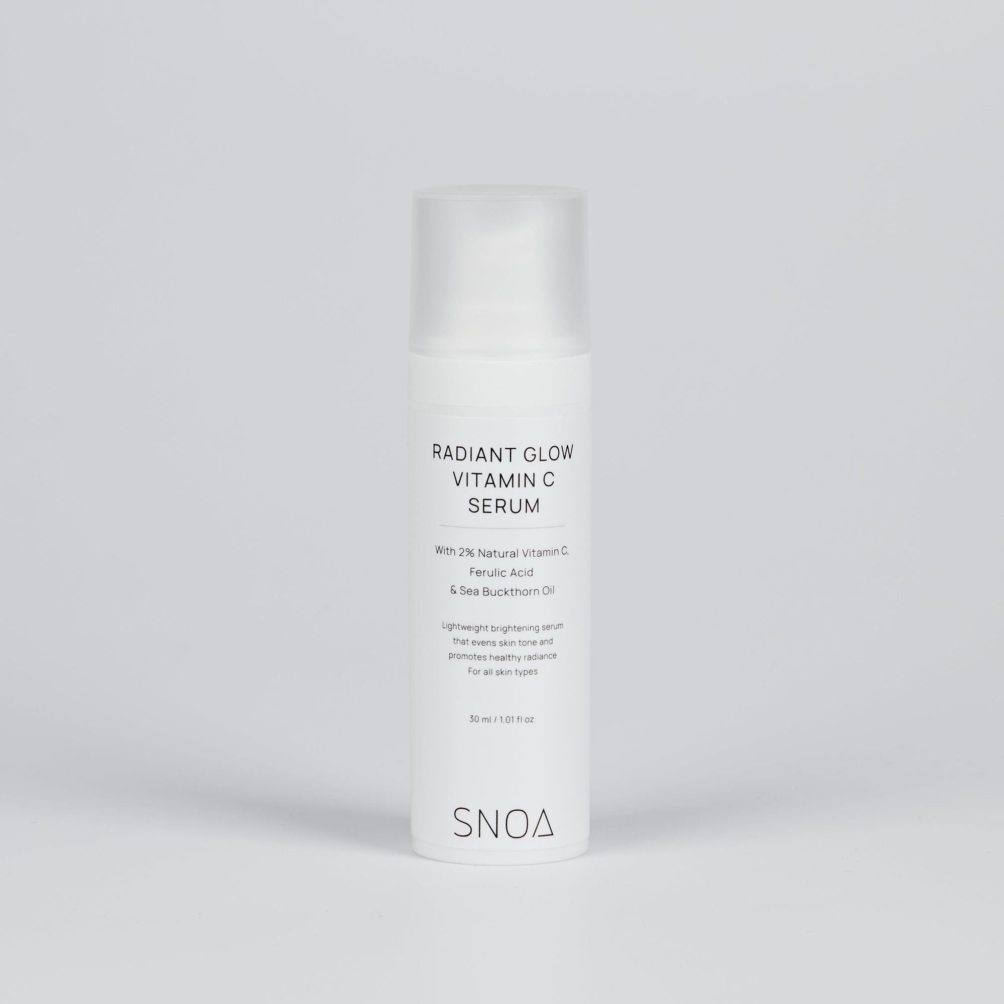 SNOA Radiant Glow Vitamin C Serum bottle on a light gray background