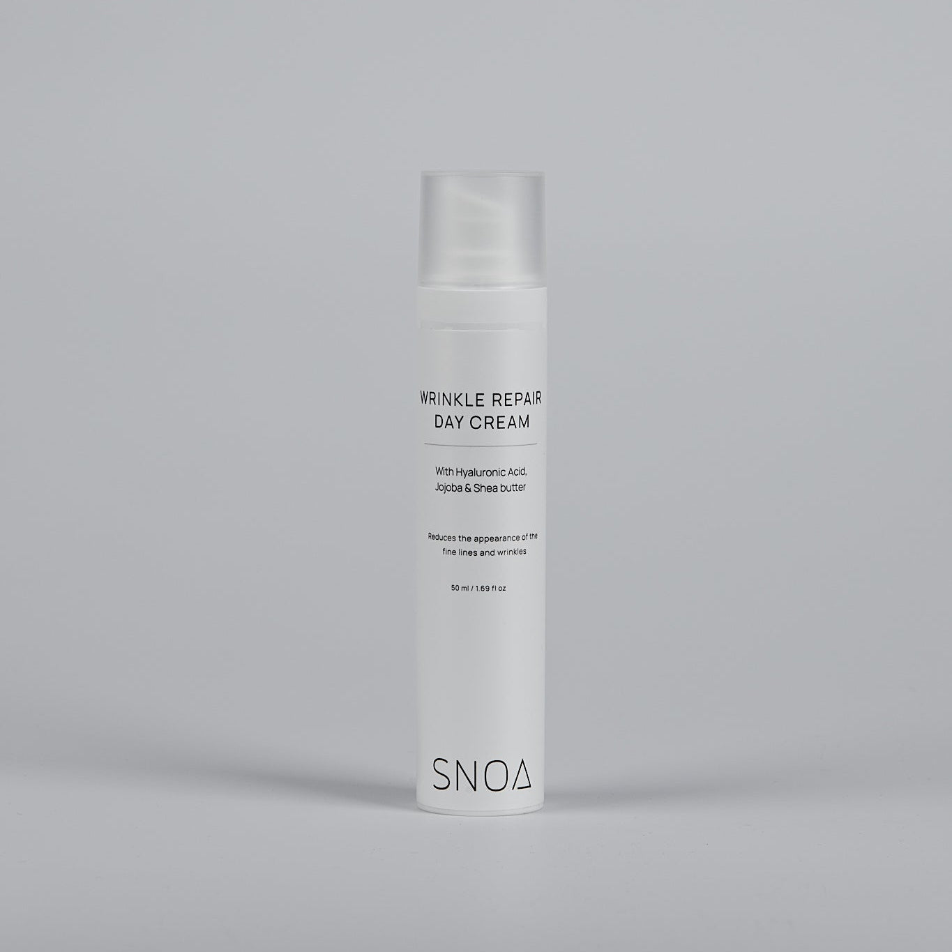 SNOA wrinkle repair day cream bottle on a gray background