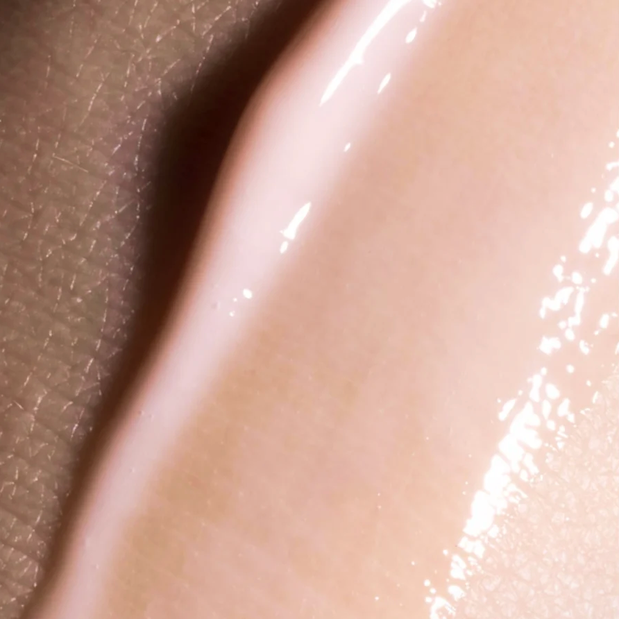 Close-up of a smooth, beige-colored surface with a slight sheen.