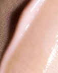 Close-up of a smooth, beige-colored surface with a slight sheen.